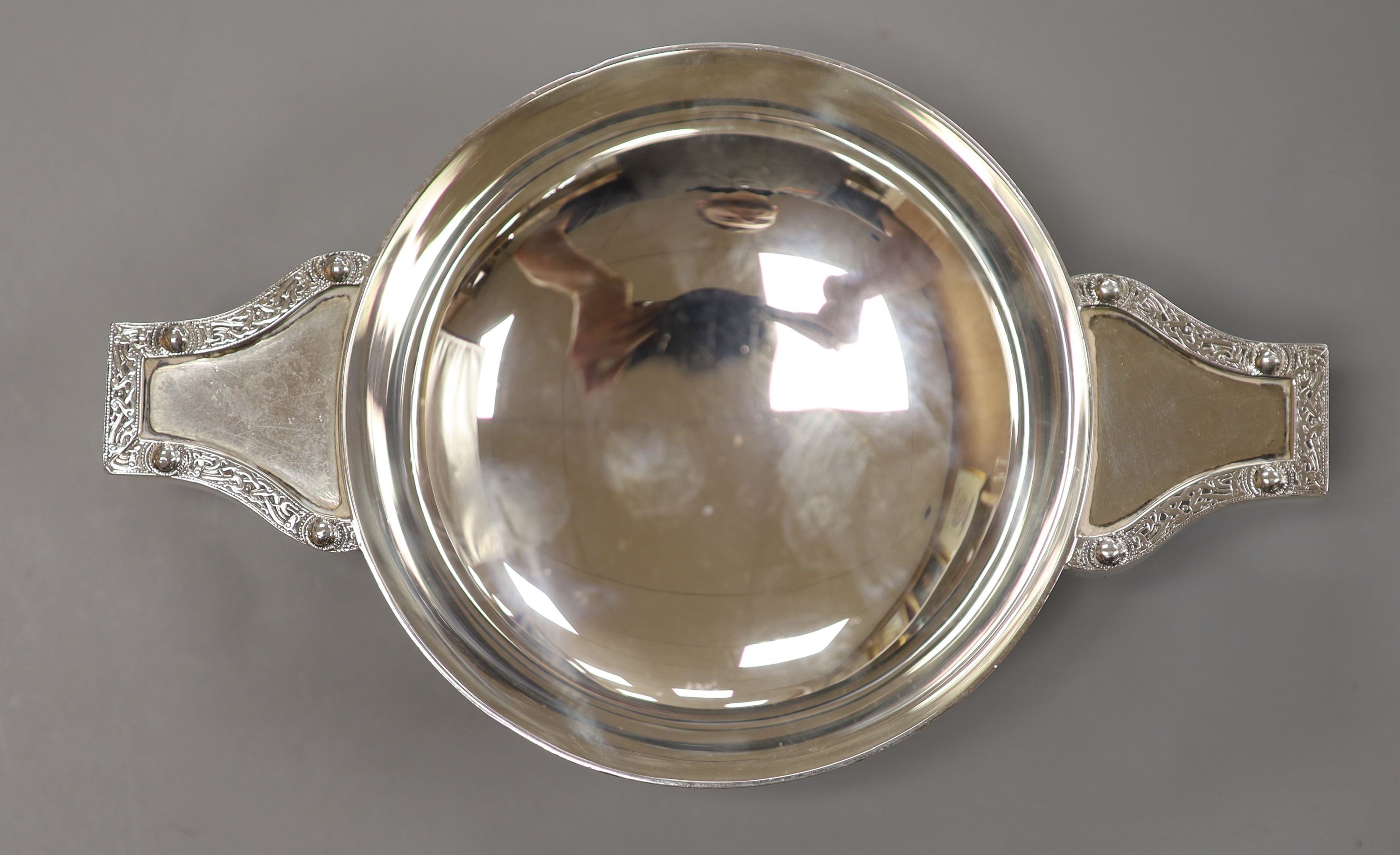 A cased pair of silver clothes brushes, silver quaich-type trophy and a George III silver dessert spoon.